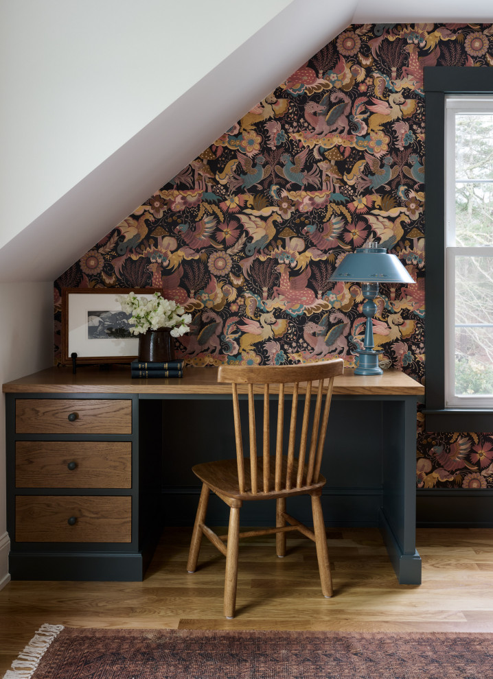 Example of a transitional home office design in Boston