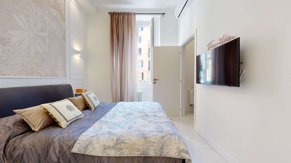 Photo of a small modern master bedroom in Milan with white walls, porcelain flooring, white floors, a drop ceiling and wainscoting.