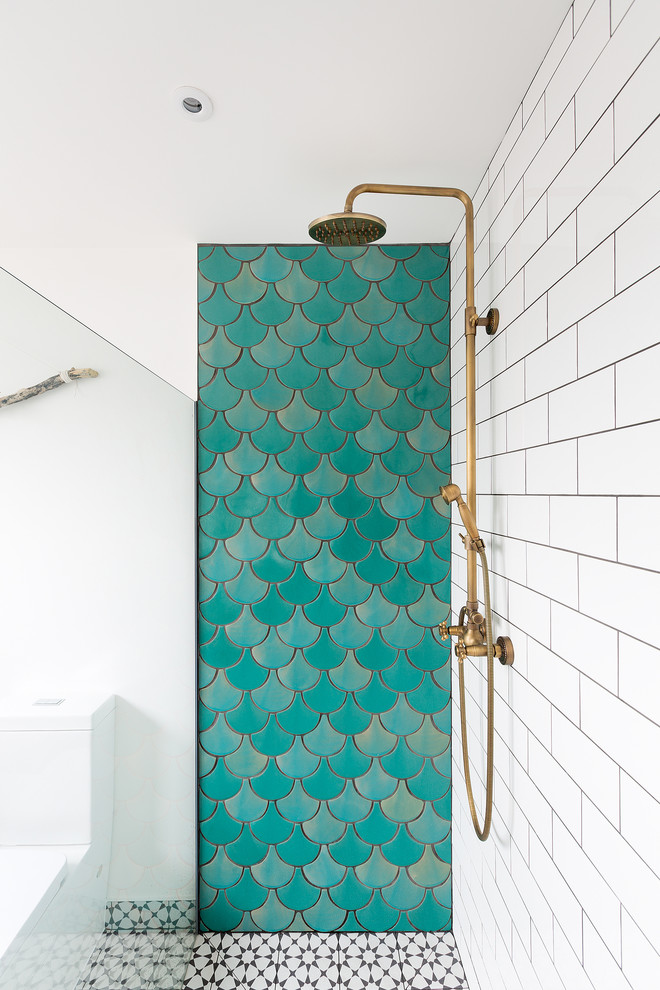 This is an example of a contemporary bathroom in London with a hot tub, an open shower, green tile, ceramic tile, white walls and cement tiles.