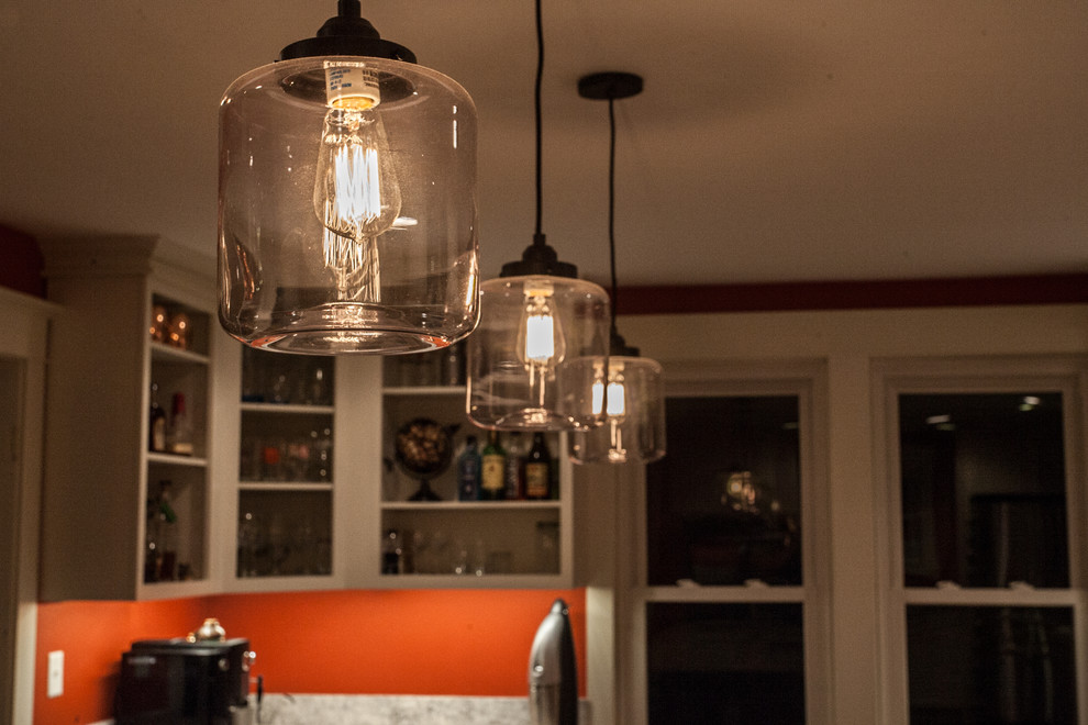 Inspiration for a large transitional u-shaped light wood floor and brown floor enclosed kitchen remodel in Baltimore with an undermount sink, shaker cabinets, white cabinets, gray backsplash, subway tile backsplash, stainless steel appliances, an island and quartz countertops