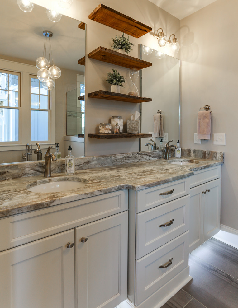 Photo of a mid-sized transitional master bathroom in Raleigh with recessed-panel cabinets, white cabinets, grey walls, ceramic floors, an undermount sink and marble benchtops.