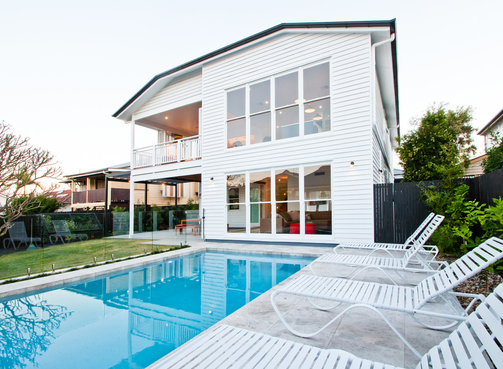 Inspiration for a transitional backyard rectangular lap pool in Brisbane with concrete pavers.