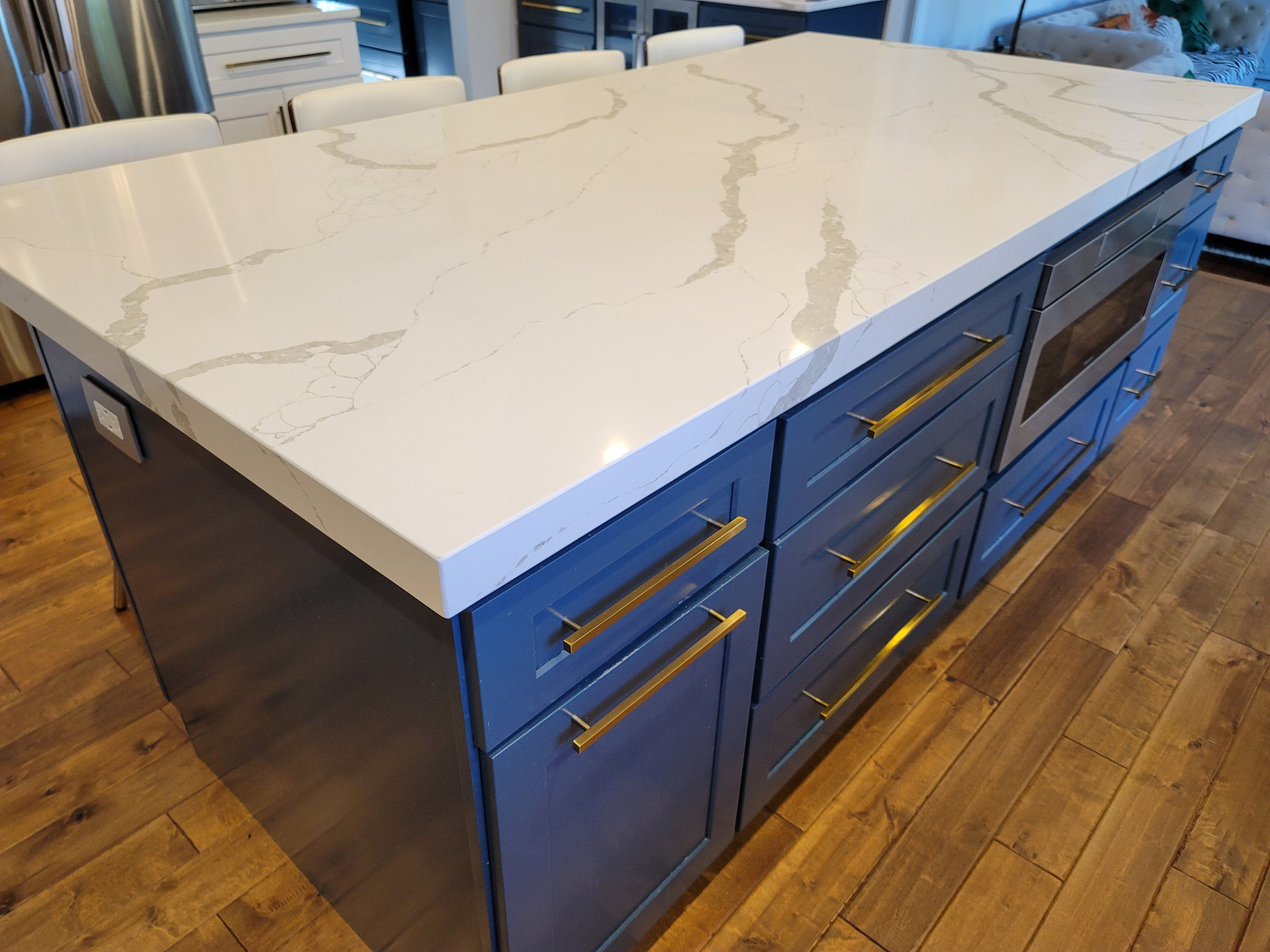 Modern kitchen design and remodel. Shaker style cabinets in white and blue.