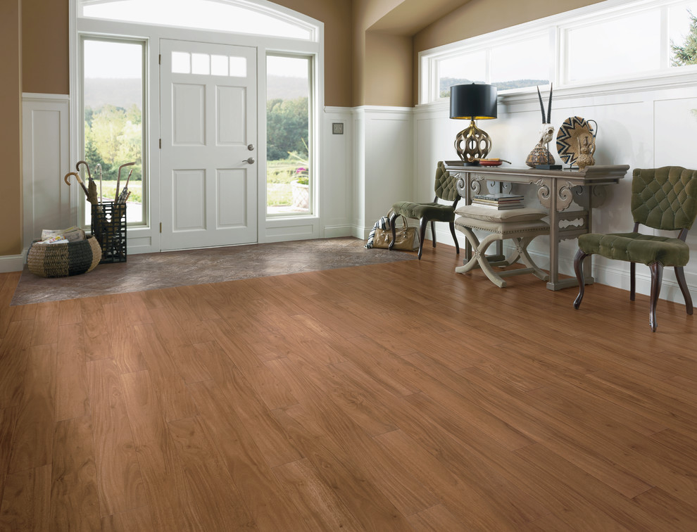 Inspiration for a large transitional vinyl floor and brown floor foyer remodel with brown walls and a white front door