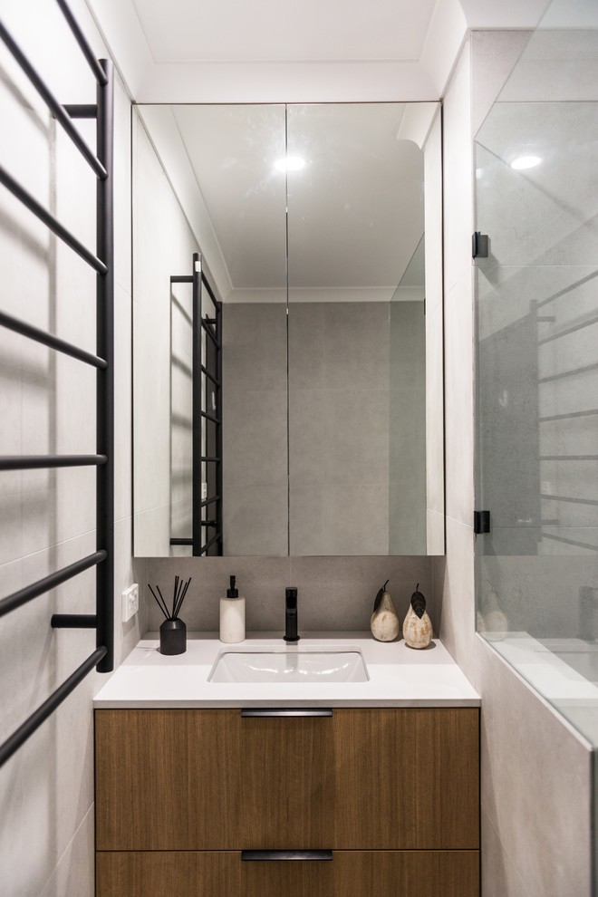 Design ideas for a large modern master bathroom in Perth with open cabinets, light wood cabinets, a freestanding tub, an open shower, multi-coloured tile, porcelain tile, multi-coloured walls, porcelain floors, an undermount sink, solid surface benchtops, beige floor, an open shower and white benchtops.