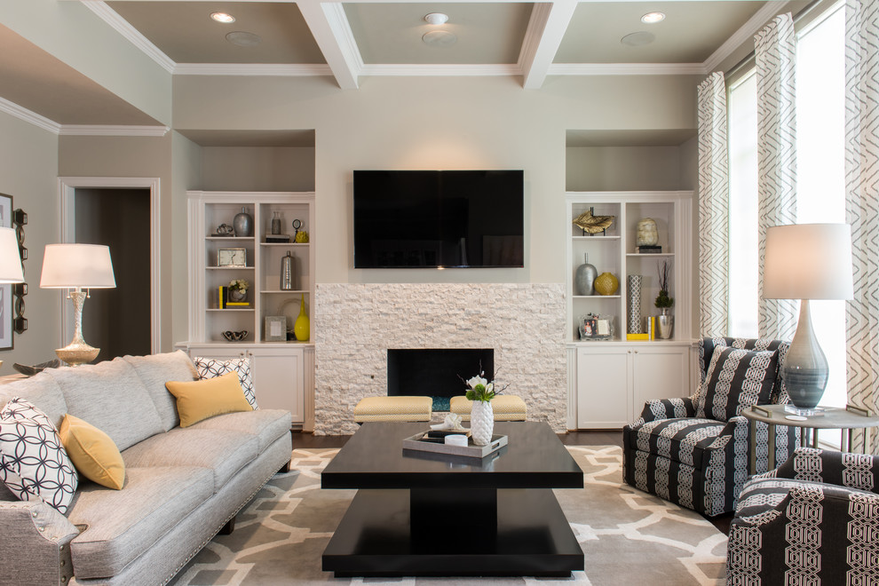 Photo of a mid-sized transitional open concept family room in Dallas with grey walls, dark hardwood floors, a standard fireplace, a stone fireplace surround, a wall-mounted tv and brown floor.