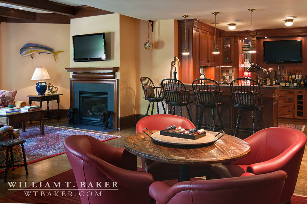 Photo of a mid-sized traditional u-shaped seated home bar in Atlanta with recessed-panel cabinets, dark wood cabinets, tile benchtops and multi-coloured splashback.