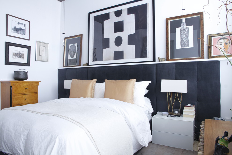 Inspiration for an eclectic bedroom in Montreal with white walls.