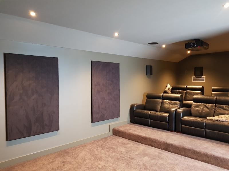 Design ideas for a mid-sized modern enclosed home theatre in Adelaide with green walls, carpet, a projector screen and brown floor.
