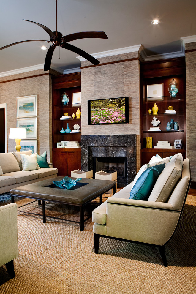 This is an example of a tropical formal open concept living room in Other with a standard fireplace, a wall-mounted tv, dark hardwood floors, a stone fireplace surround and brown walls.
