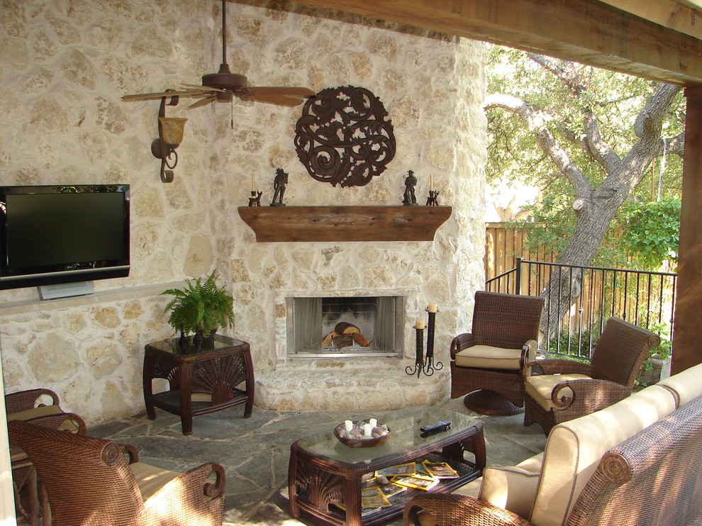 Traditional patio in Dallas with a fire feature and a roof extension.