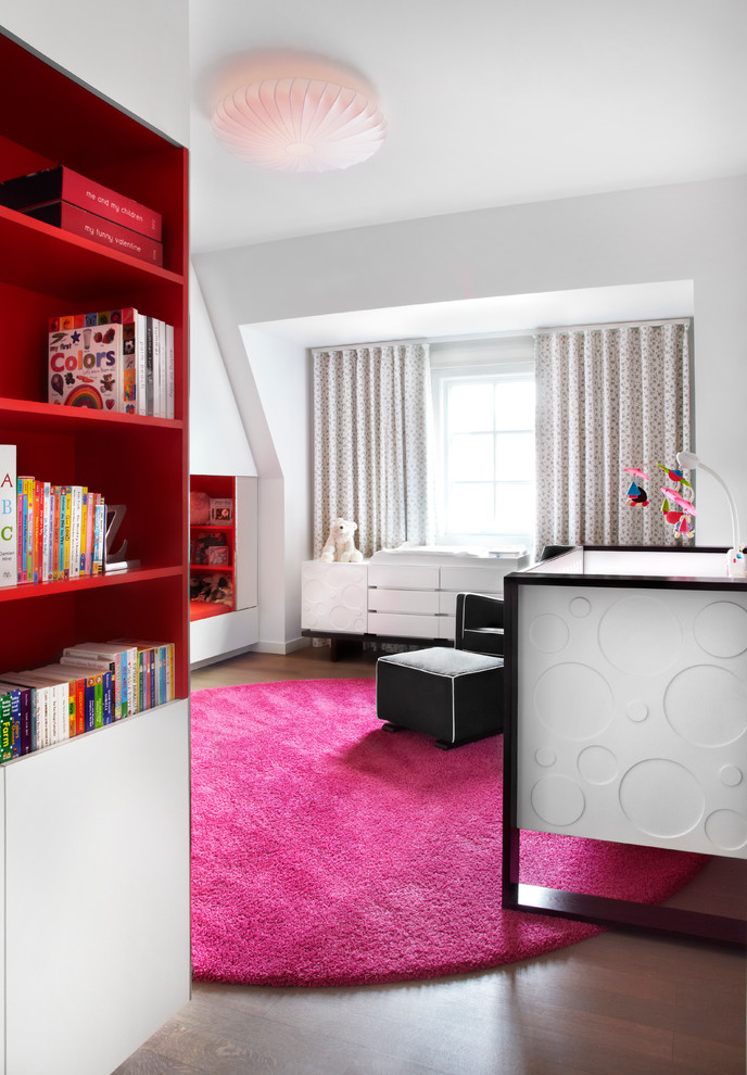 Mid-sized modern kids' room in Toronto with white walls and dark hardwood floors for girls.