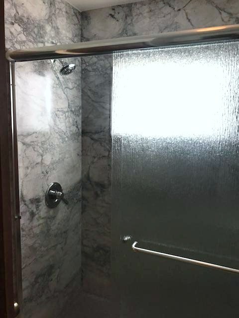 Small transitional 3/4 alcove shower photo in Denver with shaker cabinets, gray cabinets, an integrated sink, laminate countertops, gray countertops and white walls