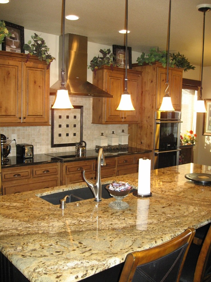 Example of a transitional kitchen design in Denver