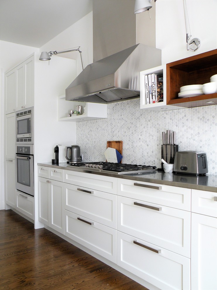 Large transitional galley dark wood floor open concept kitchen photo in Ottawa with an undermount sink, shaker cabinets, white cabinets, quartzite countertops, mosaic tile backsplash, stainless steel appliances and an island