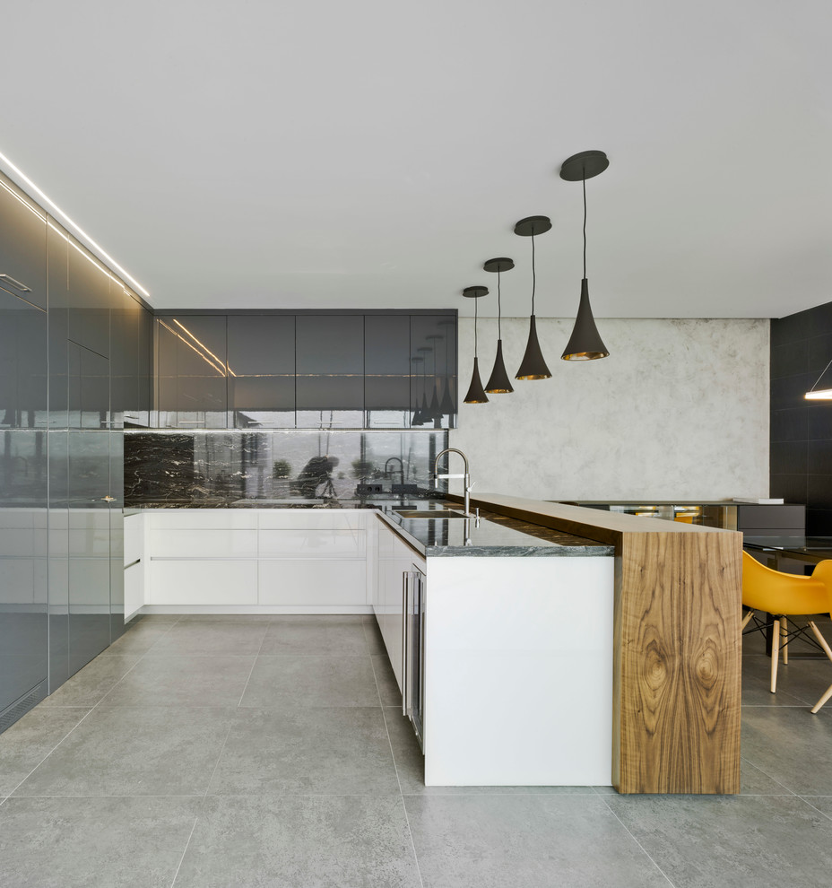 Photo of a large modern l-shaped eat-in kitchen in Alicante-Costa Blanca with a single-bowl sink, flat-panel cabinets, white cabinets, granite benchtops, panelled appliances, ceramic floors and no island.