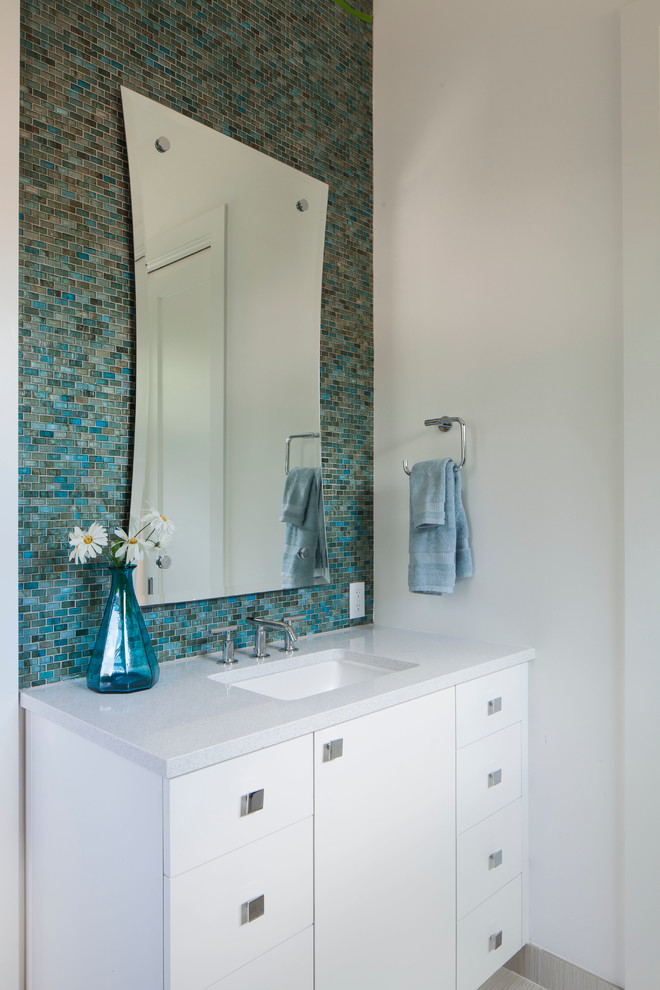 Inspiration for a contemporary bathroom in Austin with mosaic tile, blue tile and grey benchtops.