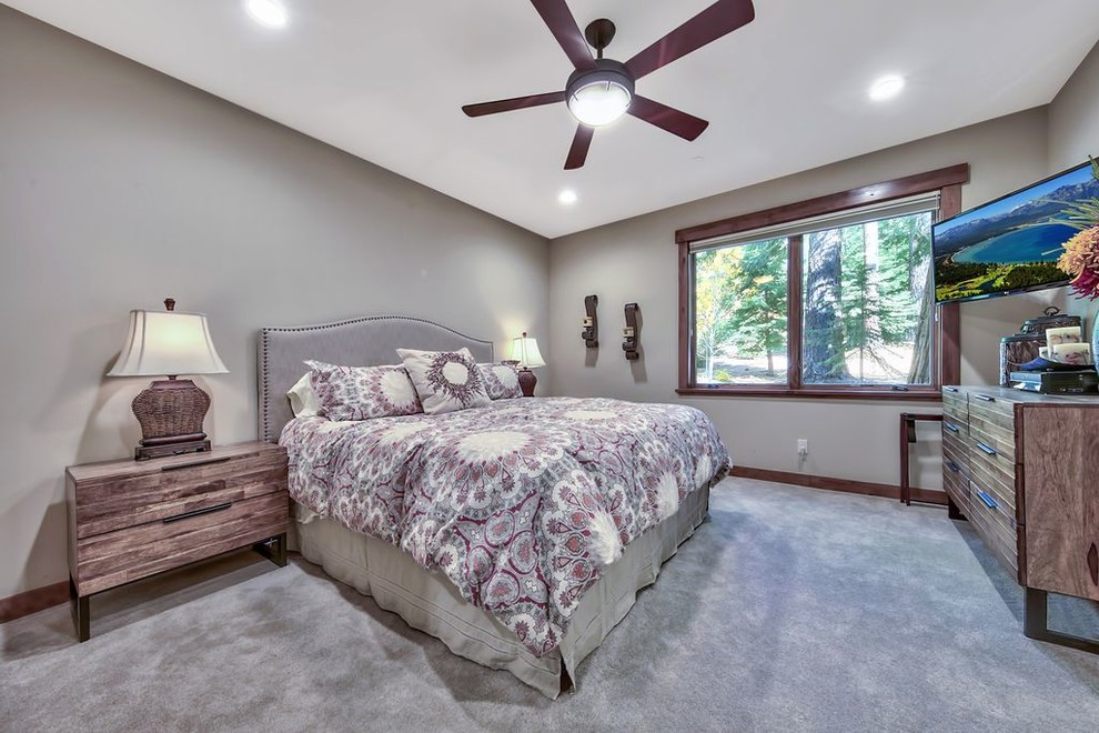 Example of a mid-sized transitional guest carpeted and gray floor bedroom design with gray walls
