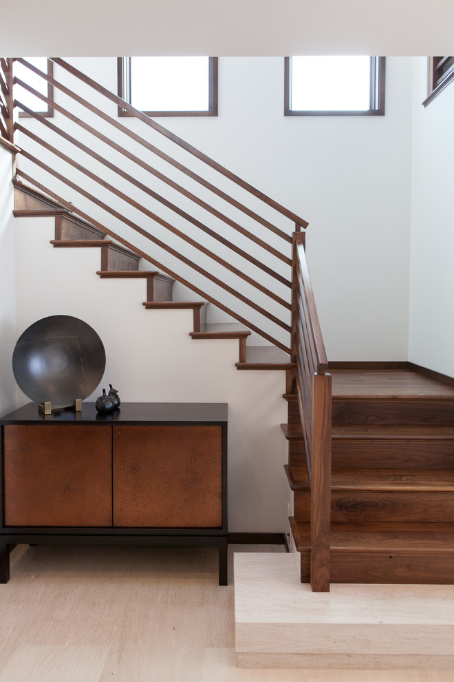 Inspiration for a transitional wood u-shaped staircase in Orange County with wood risers.