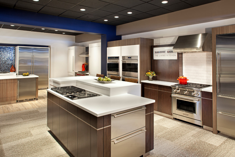 Design ideas for a kitchen in Minneapolis with panelled appliances and carpet.