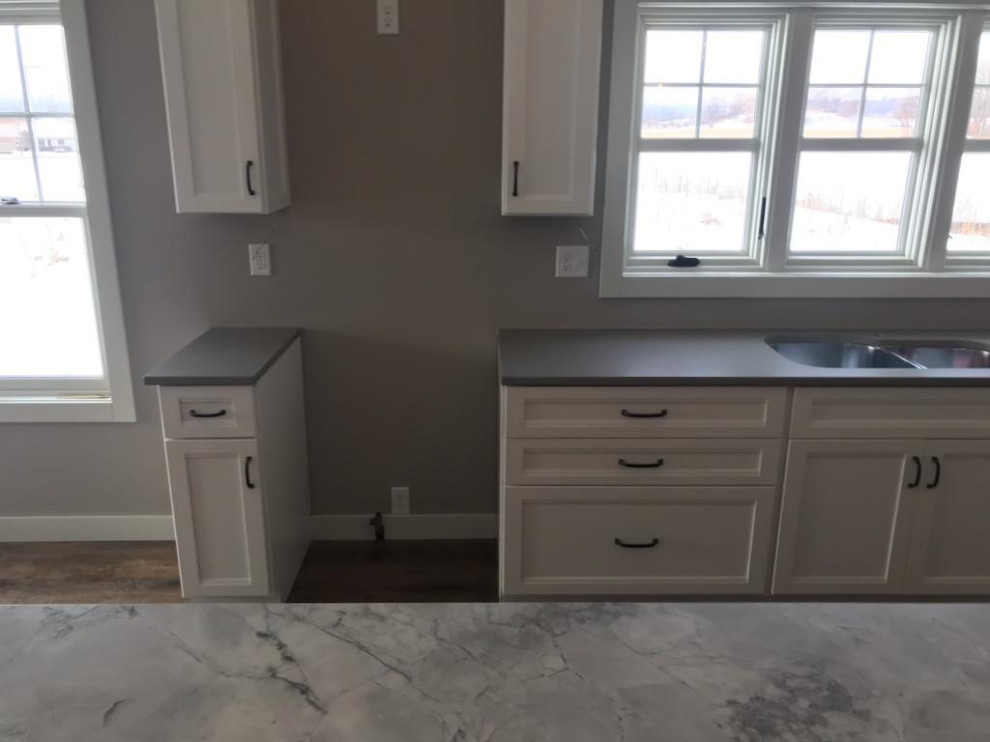 Design ideas for a modern u-shaped kitchen in Other with an undermount sink, marble benchtops, with island and grey benchtop.