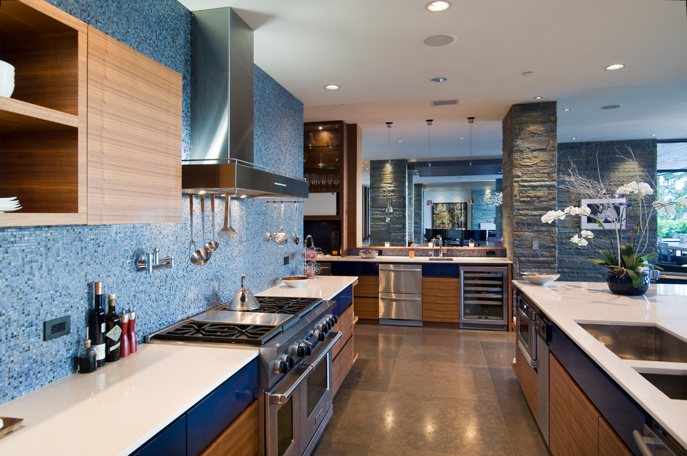 Photo of a contemporary kitchen in Vancouver with stainless steel appliances and beige floor.