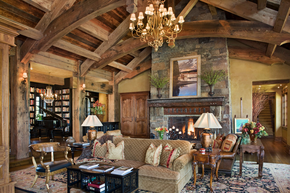 This is an example of a country living room in Other with a library.