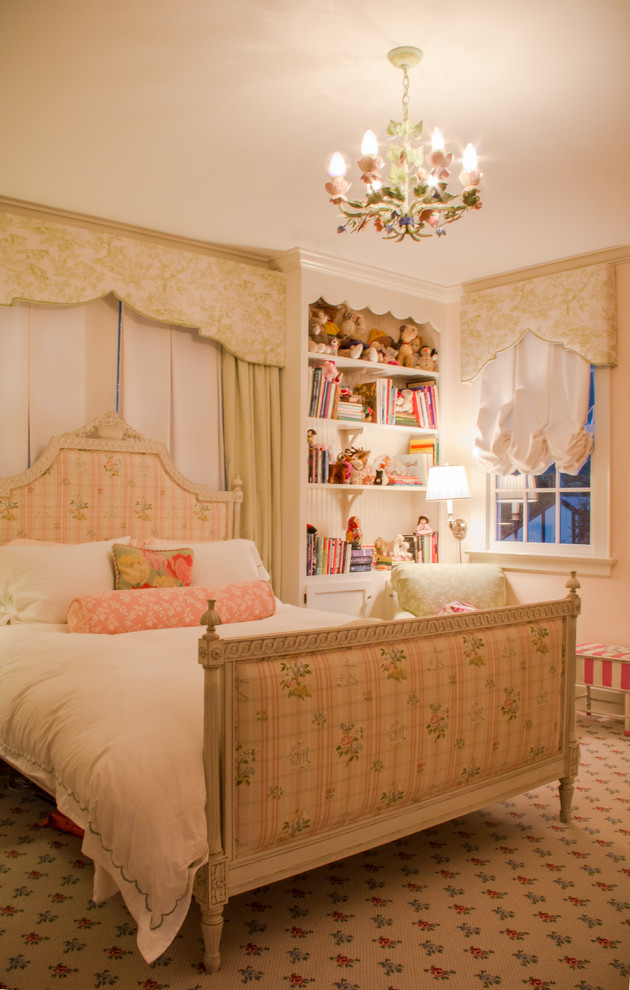 This is an example of a traditional kids' bedroom for girls in Other with beige walls and carpet.