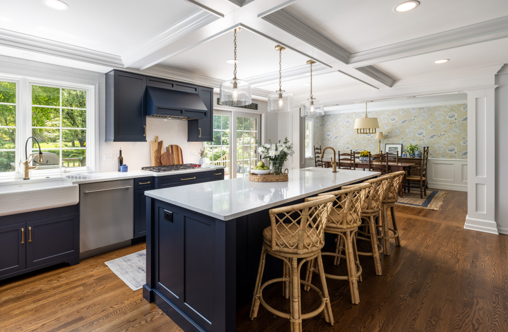 Large classic kitchen/diner in Detroit with white splashback, medium hardwood flooring, an island, brown floors, white worktops and a coffered ceiling.