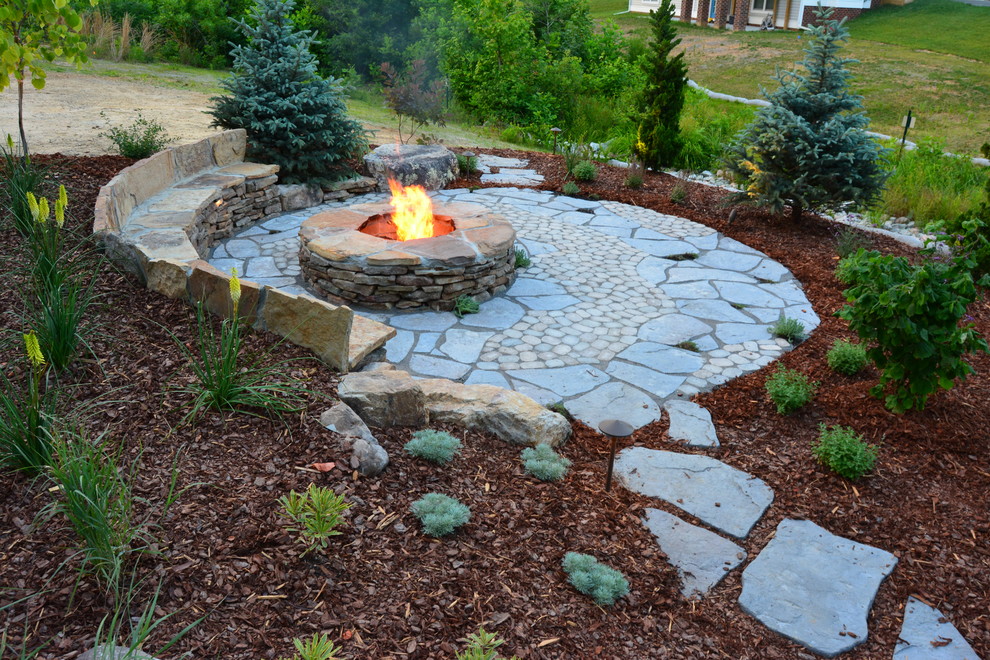 Photo of a mid-sized country backyard patio in Richmond with a fire feature, concrete pavers and no cover.