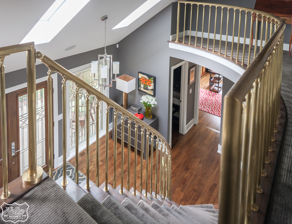 Inspiration for a huge transitional medium tone wood floor and brown floor front door remodel with gray walls and a medium wood front door