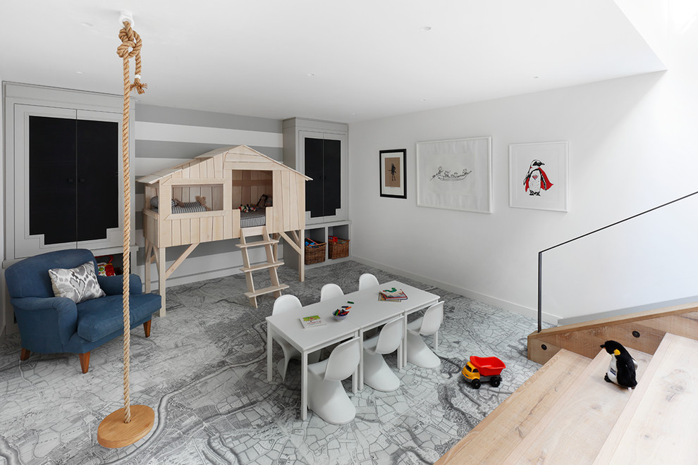 Design ideas for a contemporary gender-neutral kids' playroom for kids 4-10 years old in London with white walls.