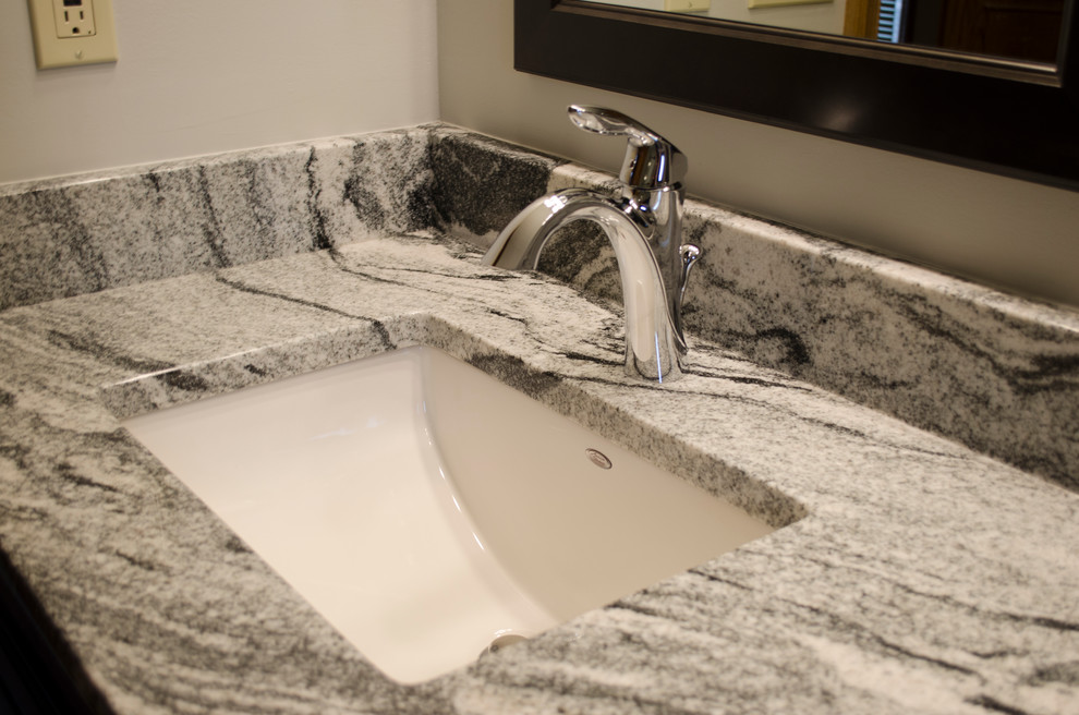 Inspiration for a transitional master bathroom remodel with recessed-panel cabinets, black cabinets, an undermount sink and granite countertops