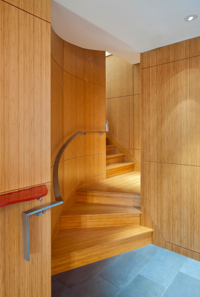 Design ideas for a modern wood staircase in Boston with wood risers.