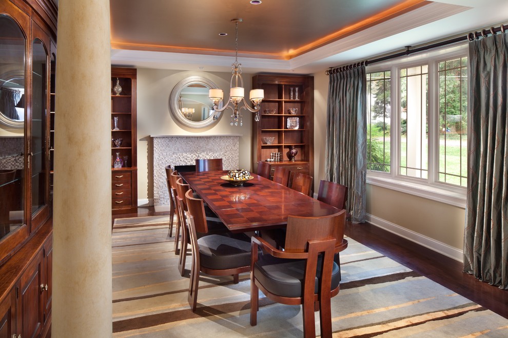 Contemporary dining room in DC Metro with beige walls and dark hardwood floors.