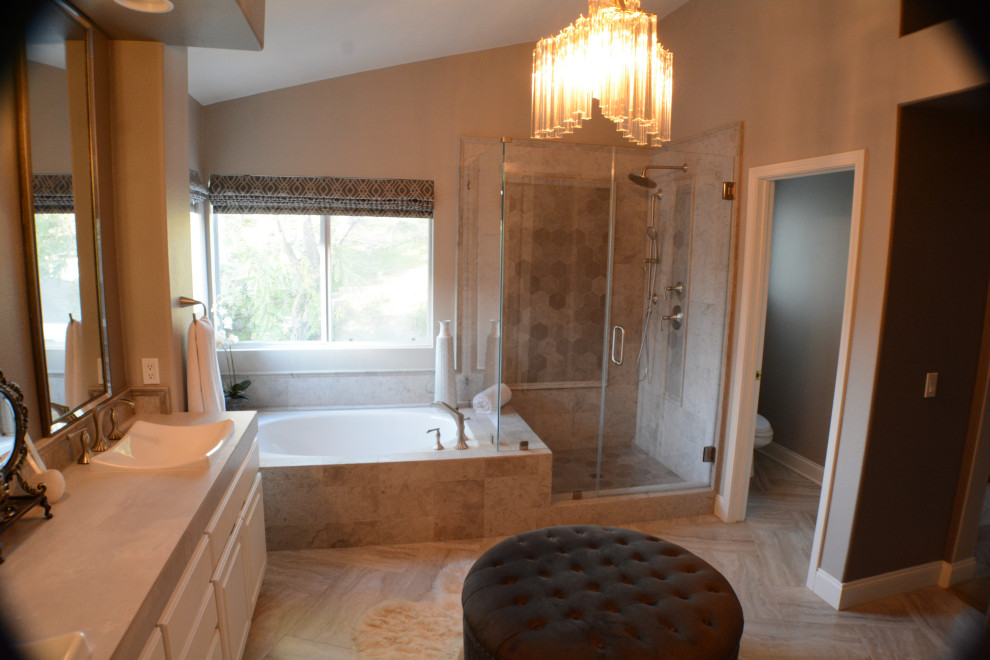 Mid-sized trendy master gray tile and marble tile porcelain tile, gray floor, double-sink and vaulted ceiling bathroom photo in Los Angeles with raised-panel cabinets, white cabinets, a two-piece toilet, beige walls, a drop-in sink, quartzite countertops, a hinged shower door, gray countertops and a built-in vanity