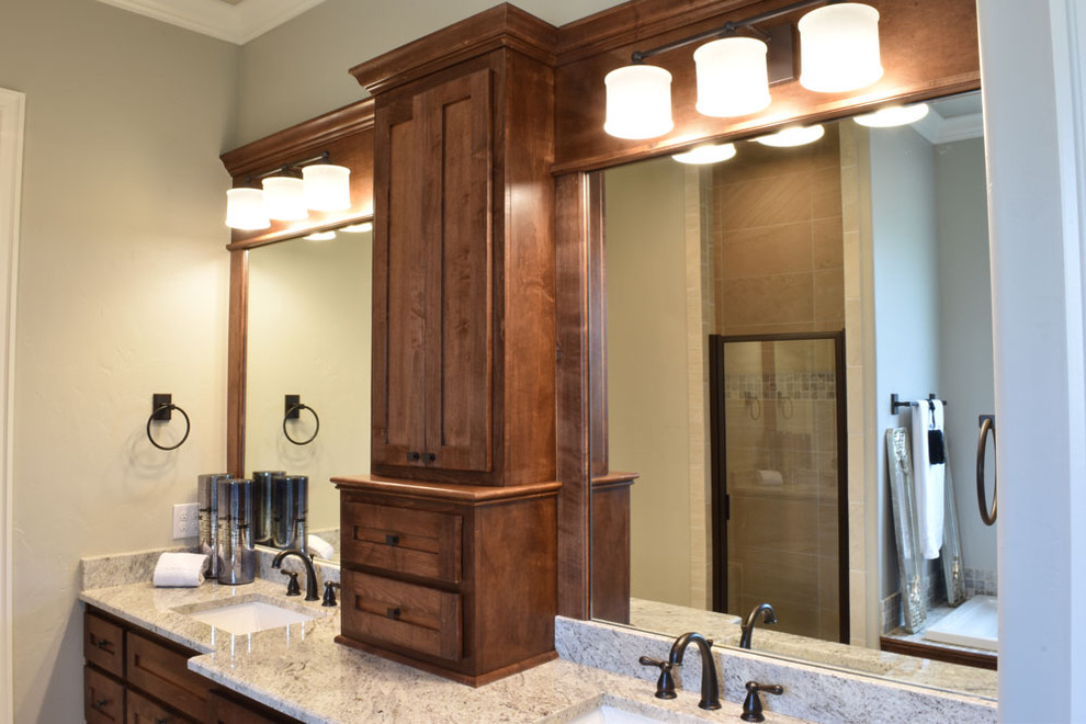 Inspiration for a mid-sized transitional master freestanding bathtub remodel with shaker cabinets, medium tone wood cabinets, gray walls, an undermount sink and granite countertops
