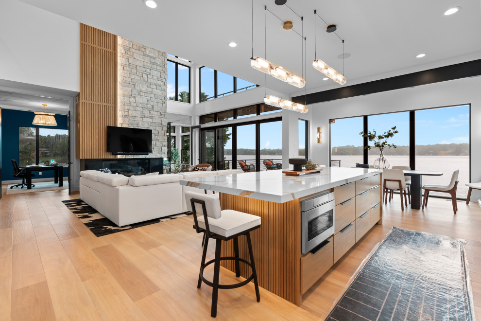 Large brown floor kitchen photo with an island