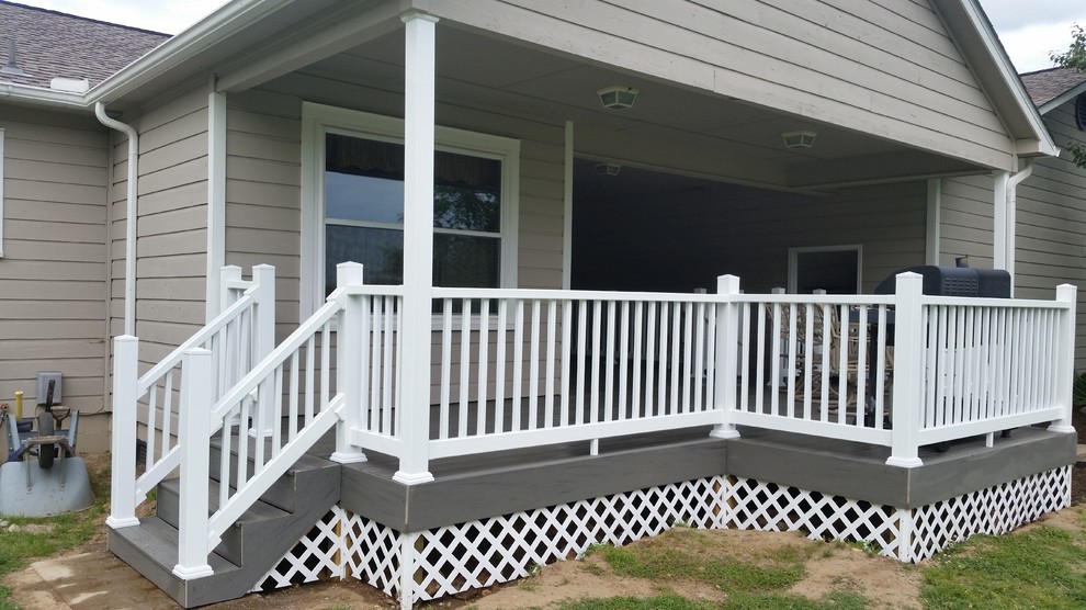 Large deck photo with a roof extension