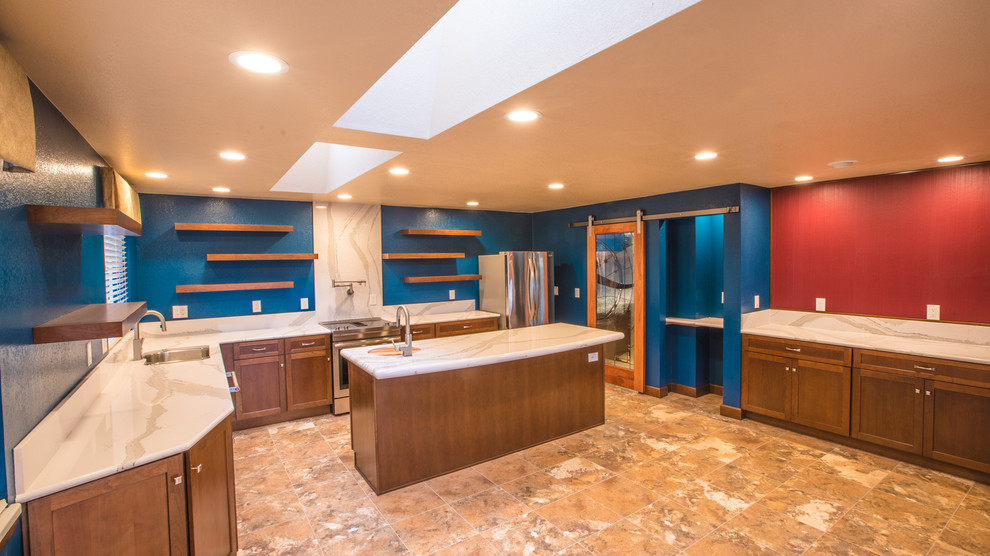 Inspiration for a large transitional l-shaped laminate floor eat-in kitchen remodel in Seattle with an undermount sink, recessed-panel cabinets, dark wood cabinets, quartz countertops, stainless steel appliances and an island