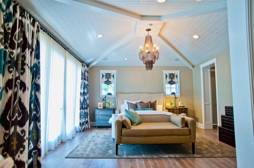 Eclectic master bedroom in Los Angeles with beige walls.
