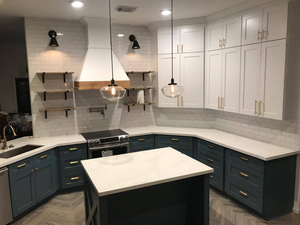 Mid-sized transitional u-shaped eat-in kitchen in Houston with turquoise cabinets, white splashback, stainless steel appliances, laminate floors, with island, beige floor, white benchtop, coffered, an undermount sink, shaker cabinets, quartzite benchtops and ceramic splashback.