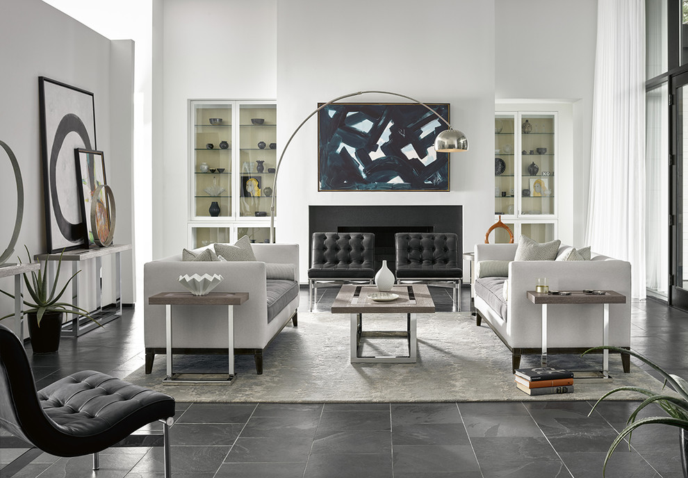 Photo of a modern formal open concept living room in Houston with white walls, slate floors, a standard fireplace, a stone fireplace surround and black floor.