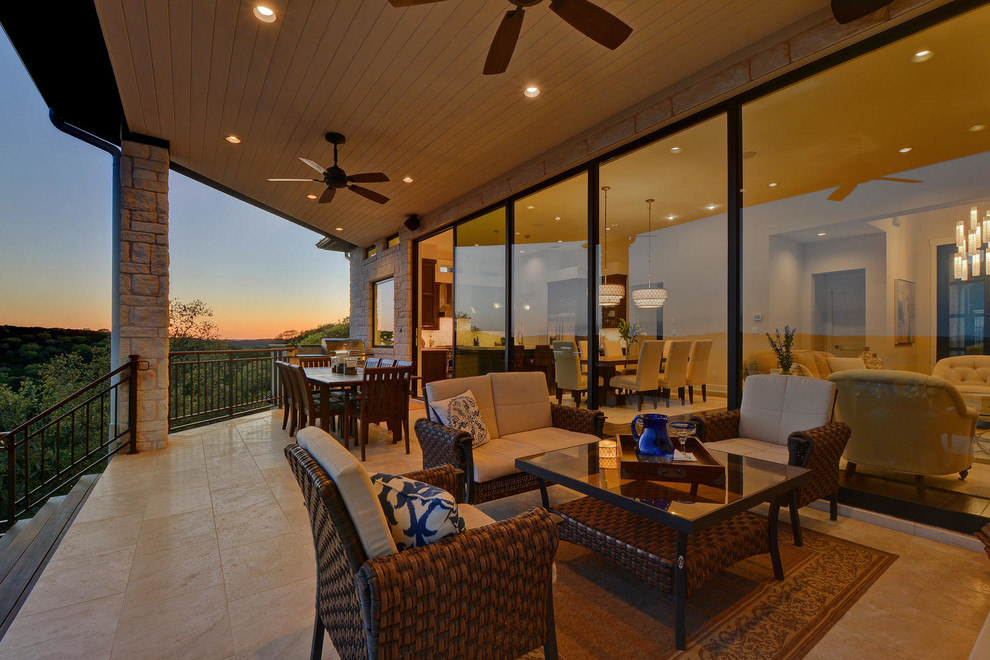 Patio kitchen - large transitional backyard patio kitchen idea in Austin with decking and a roof extension