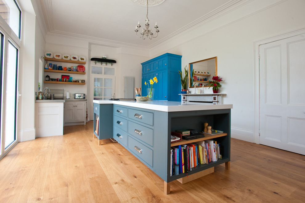 Contemporary kitchen in Cornwall with shaker cabinets and blue cabinets.