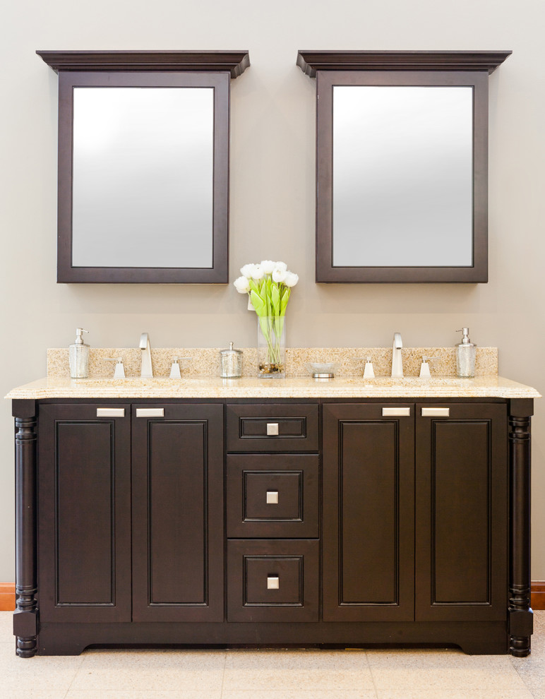 This is an example of a transitional bathroom in New York with flat-panel cabinets and dark wood cabinets.