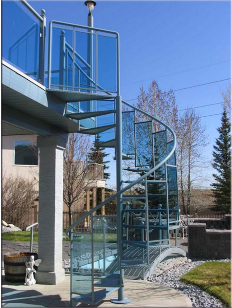 Example of a mid-sized transitional spiral staircase design in Calgary