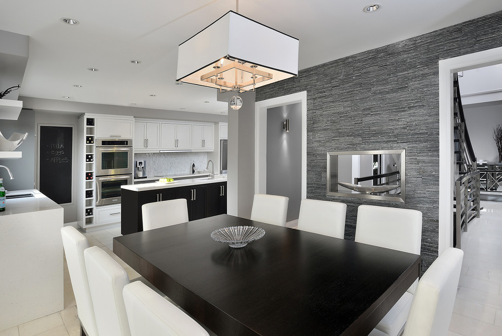 Inspiration for a contemporary l-shaped eat-in kitchen in Toronto with an undermount sink, shaker cabinets, white cabinets, quartzite benchtops, white splashback, mosaic tile splashback, stainless steel appliances, marble floors and with island.
