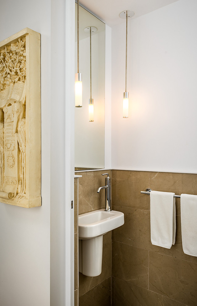 Photo of a contemporary powder room in Vancouver with a wall-mount sink.