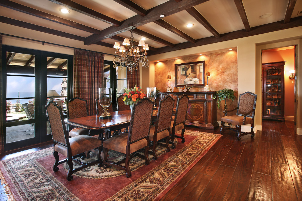 Photo of a traditional dining room in Orange County with beige walls and dark hardwood floors.